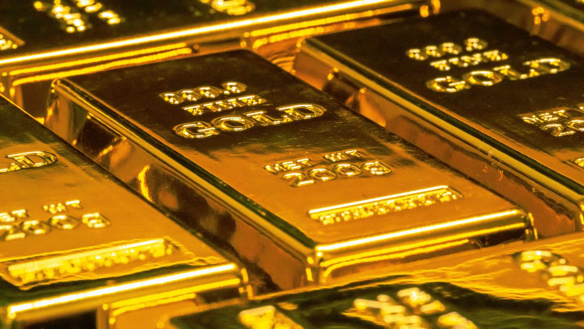 Close-up of stacked fine gold bars