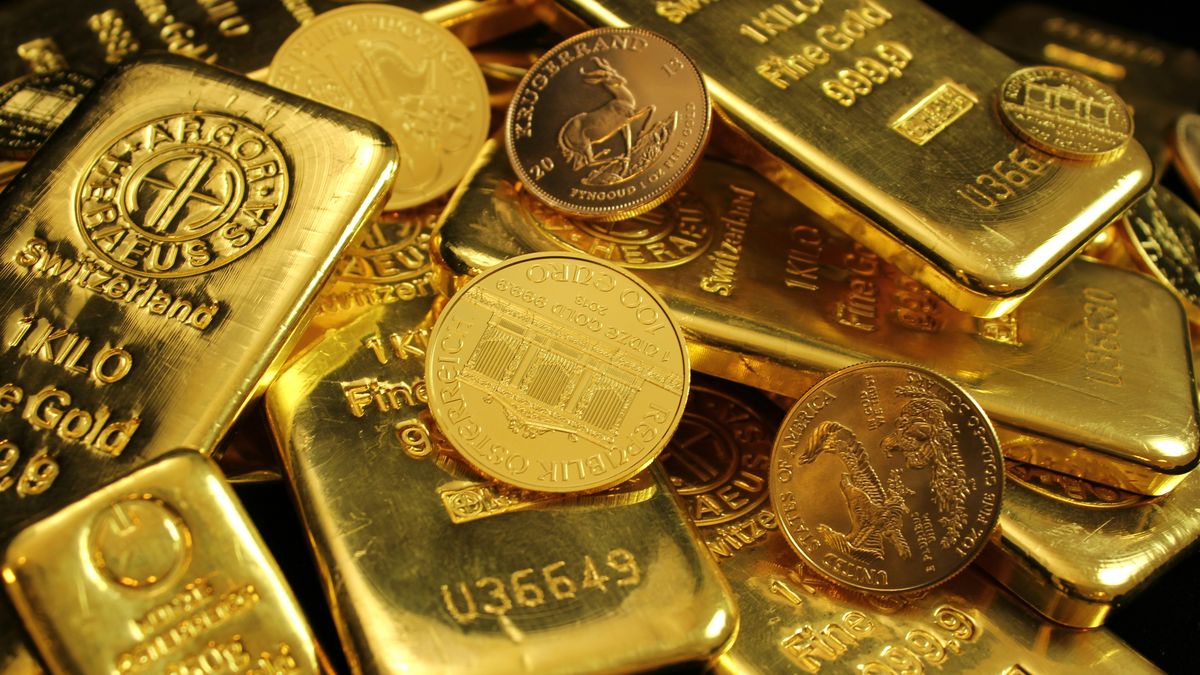 Pile of gold bars and gold coins