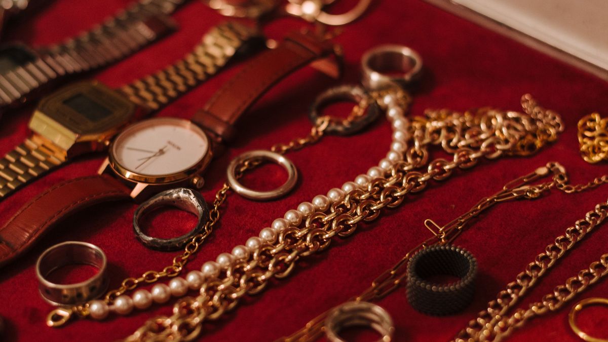Old gold jewellery on red velvet