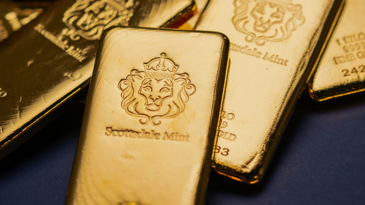 Pile of gold bars on a blue background